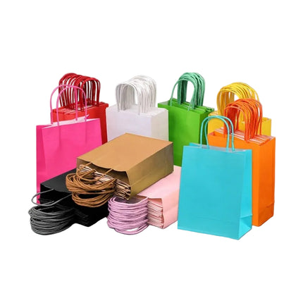 Assorted colorful paper shopping bags on a gray background