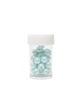 Clear jar filled with light blue beads on a white background